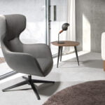 Swivel armchair in eco-leather and black epoxy steel legs