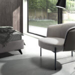 Grey fabric and dark grey leatherette armchair