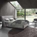 Grey fabric and dark grey leatherette armchair