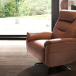 Brown leather swivel armchair