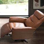 Brown leather swivel armchair