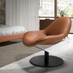 Brown leatherette swivel armchair