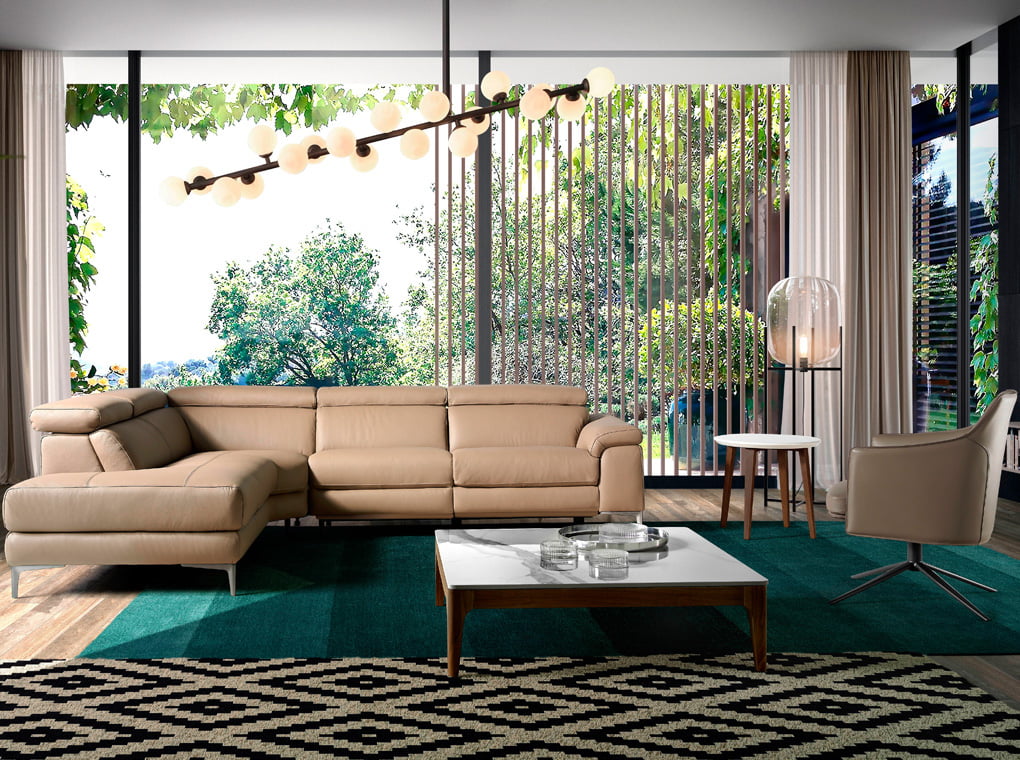Corner sofa upholstered in leather and stainless steel legs Corner sofa upholstered in leather and stainless steel legs