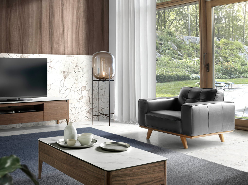 Leather upholstered Armchair with solid walnut legs Leather upholstered Armchair with solid walnut legs