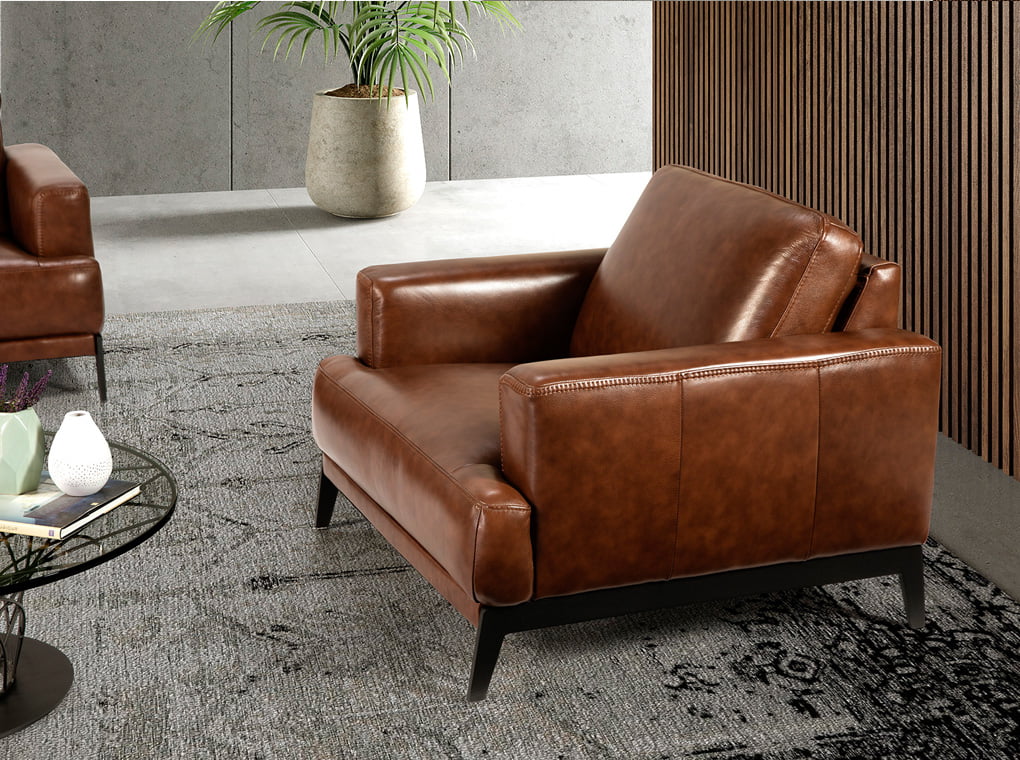 Upholstered leather armchair with steel legs painted in black Upholstered leather armchair with steel legs painted in black