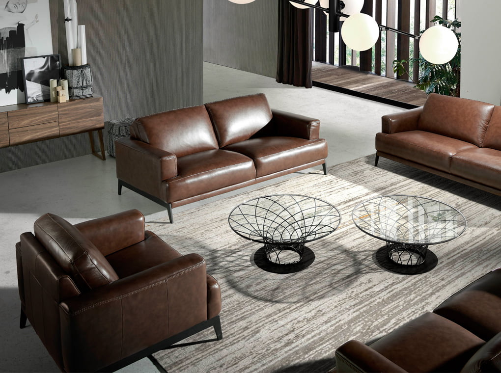 Upholstered leather armchair with steel legs painted in black Upholstered leather armchair with steel legs painted in black