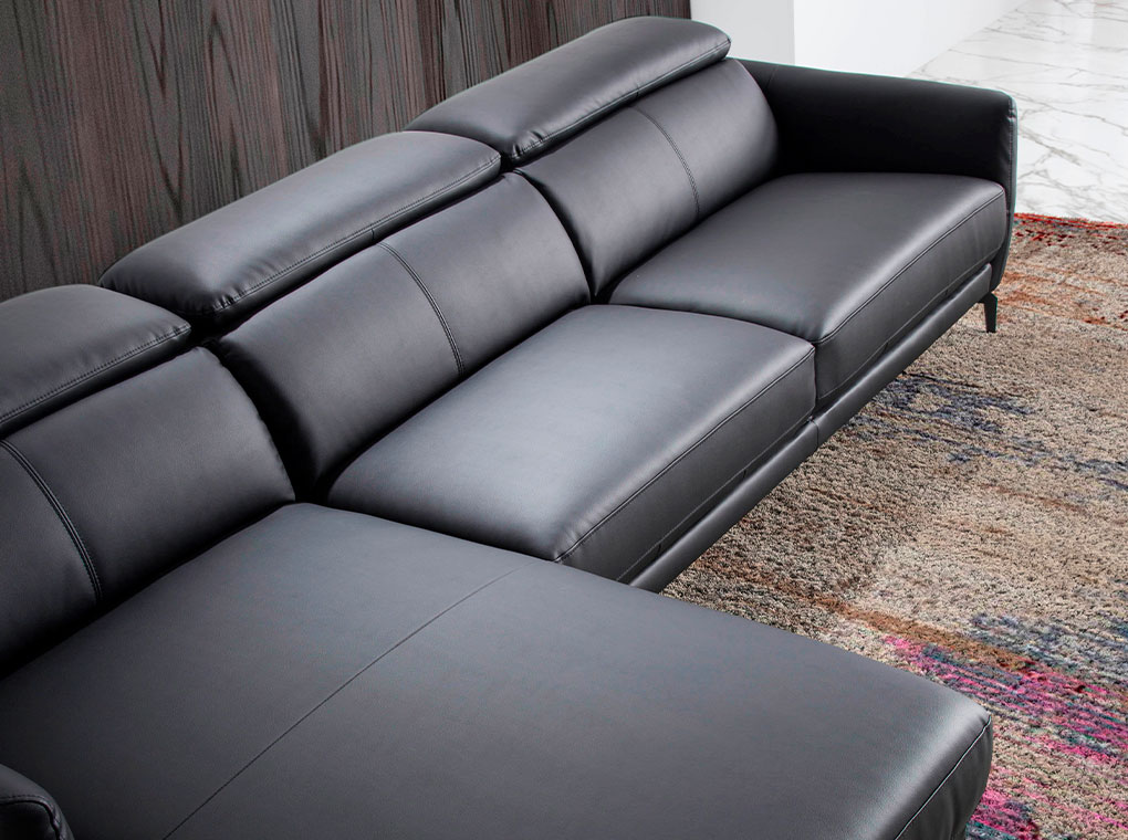 Chaise longue sofa upholstered in leather and black steel legs
