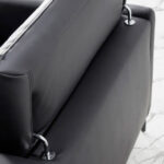 Chaise longue sofa upholstered in leather and black steel legs