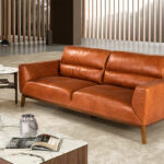 2-seater sofa upholstered in leather with Walnut wood legs