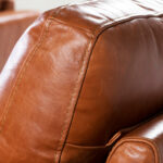 2-seater sofa upholstered in leather with Walnut wood legs