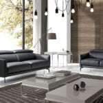 3-seater sofa upholstered in leather with black steel legs