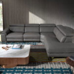 Leather upholstered corner sofa with relax mechanism