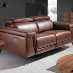 2 seater sofa upholstered in leather with relax mechanisms