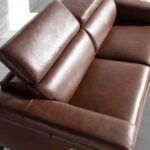 2 seater sofa upholstered in leather with relax mechanisms