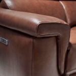 2 seater sofa upholstered in leather with relax mechanisms