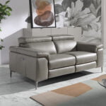 2 seater sofa upholstered in leather with relax mechanism