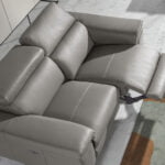 2 seater sofa upholstered in leather with relax mechanism