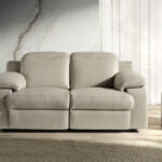 2 seater sofa upholstered in leather with relax mechanism