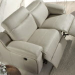 2 seater sofa upholstered in leather with relax mechanism