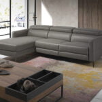 Chaise longue sofa upholstered in leather with electric relax mechanism