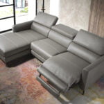 Chaise longue sofa upholstered in leather with electric relax mechanism