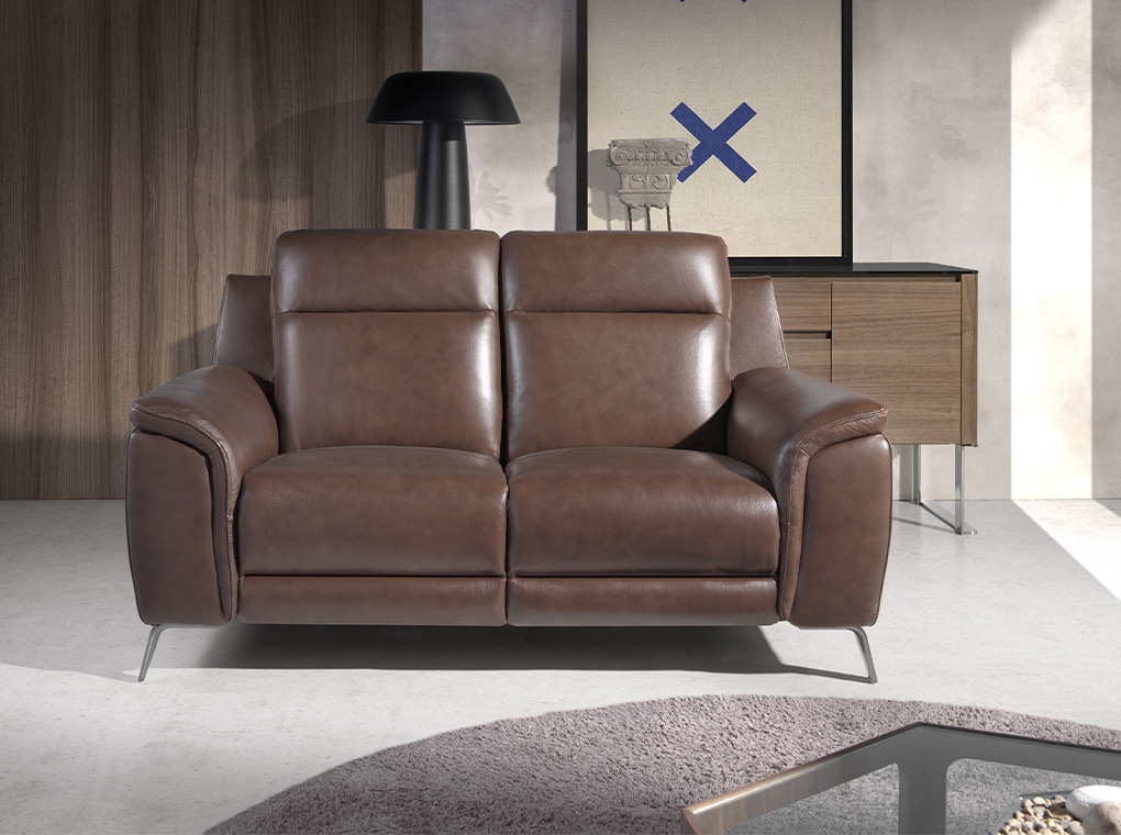 2 seater sofa upholstered in leather with electric relax mechanism