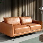 3 seater sofa upholstered in buffalo brown cowhide leather with base in steamed beech wood. Leg structure in solid darkened steel.