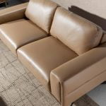 3 seater sofa upholstered in leather and black steel legs