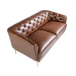 2 seater sofa upholstered in leather with golden polished steel legs