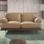 2-seater sofa upholstered in leather with black epoxy steel legs