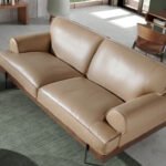 2-seater sofa upholstered in leather with black epoxy steel legs