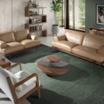 2-seater sofa upholstered in leather with black epoxy steel legs