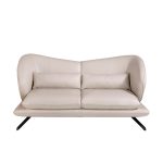 2 seater sofa upholstered in leather and decorative cushions