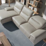 Leather upholstered chaise longue sofa with articulated backrests