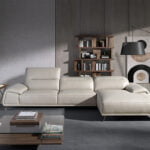 Leather upholstered chaise longue sofa with articulated backrests