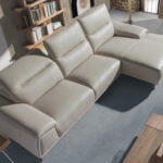 Leather upholstered chaise longue sofa with articulated backrests