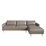 Chaise longue sofa upholstered in leather and legs in darkened steel.