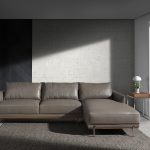 Chaise longue sofa upholstered in leather and legs in darkened steel.