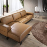 Leather upholstered chaise longue sofa with black steel legs