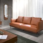 3 seater sofa upholstered in leather with darkened steel legs