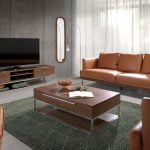 3 seater sofa upholstered in leather with darkened steel legs