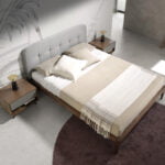 Bed upholstered in fabric with Walnut wood frame