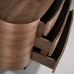 Oval chest of drawers in walnut coloured wood and black steel legs