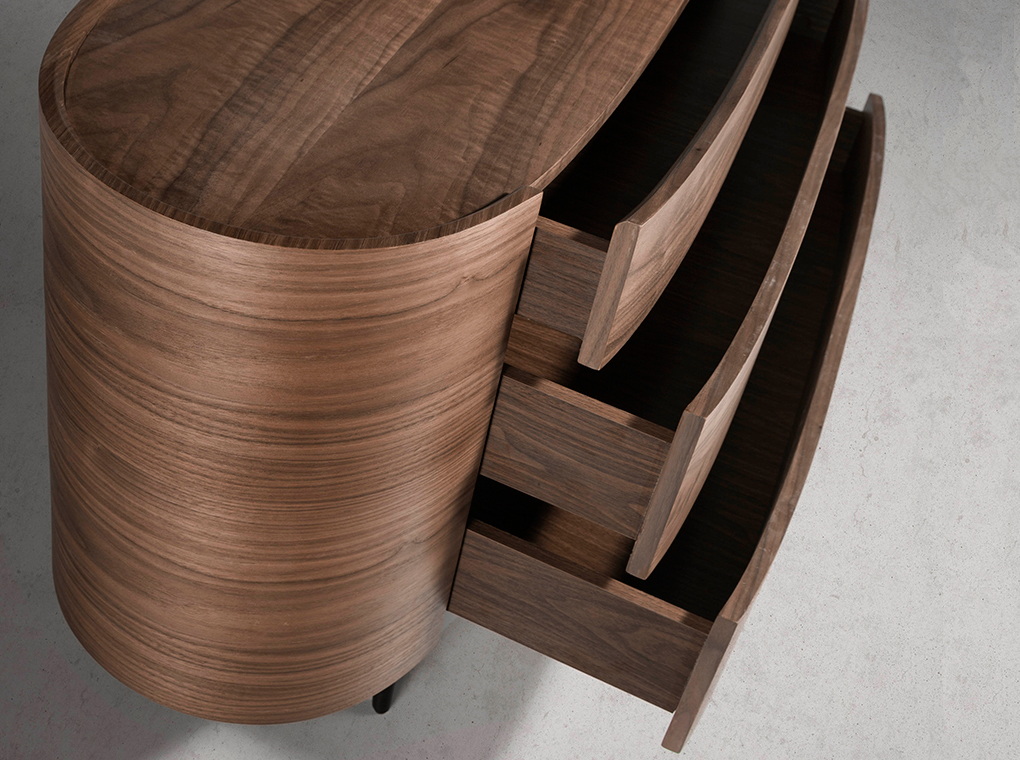 Oval chest of drawers in walnut coloured wood and black steel legs