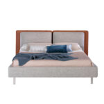 Bed upholstered in fabric and eco-leather with stainless steel legs