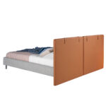 Bed upholstered in fabric and eco-leather with stainless steel legs