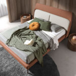 Upholstered bed in brown and grey eco-leather with steel legs
