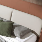 Upholstered bed in brown and grey eco-leather with steel legs