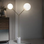 Floor lamp in calacatta marble, gilded steel and white glass