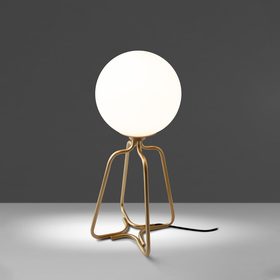 Table lamp in gilded steel and white glass